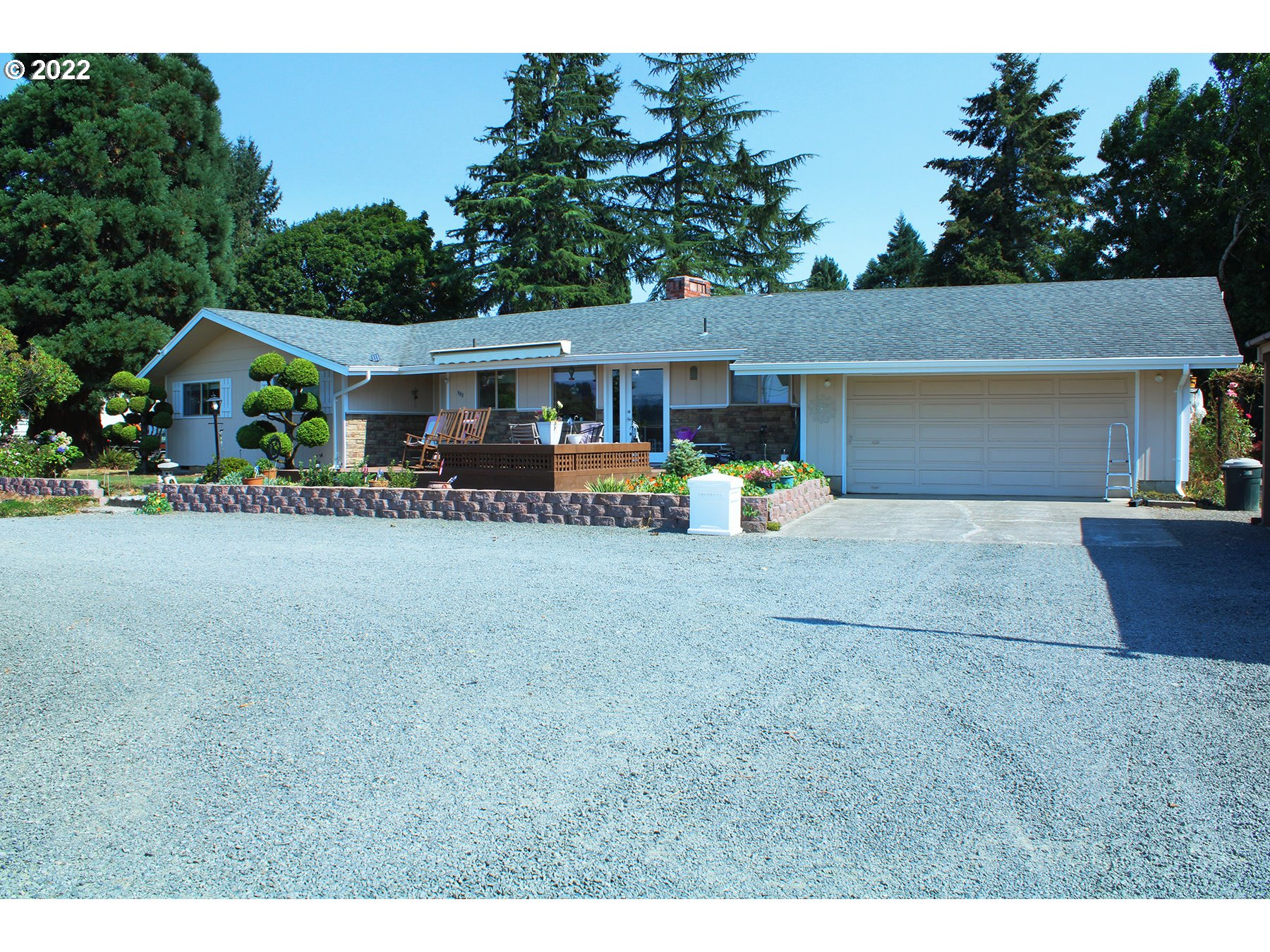 160 Roberson Road Woodland, WA 98674 - Photo 1 of 25 a view of a house with a yard and sitting area
