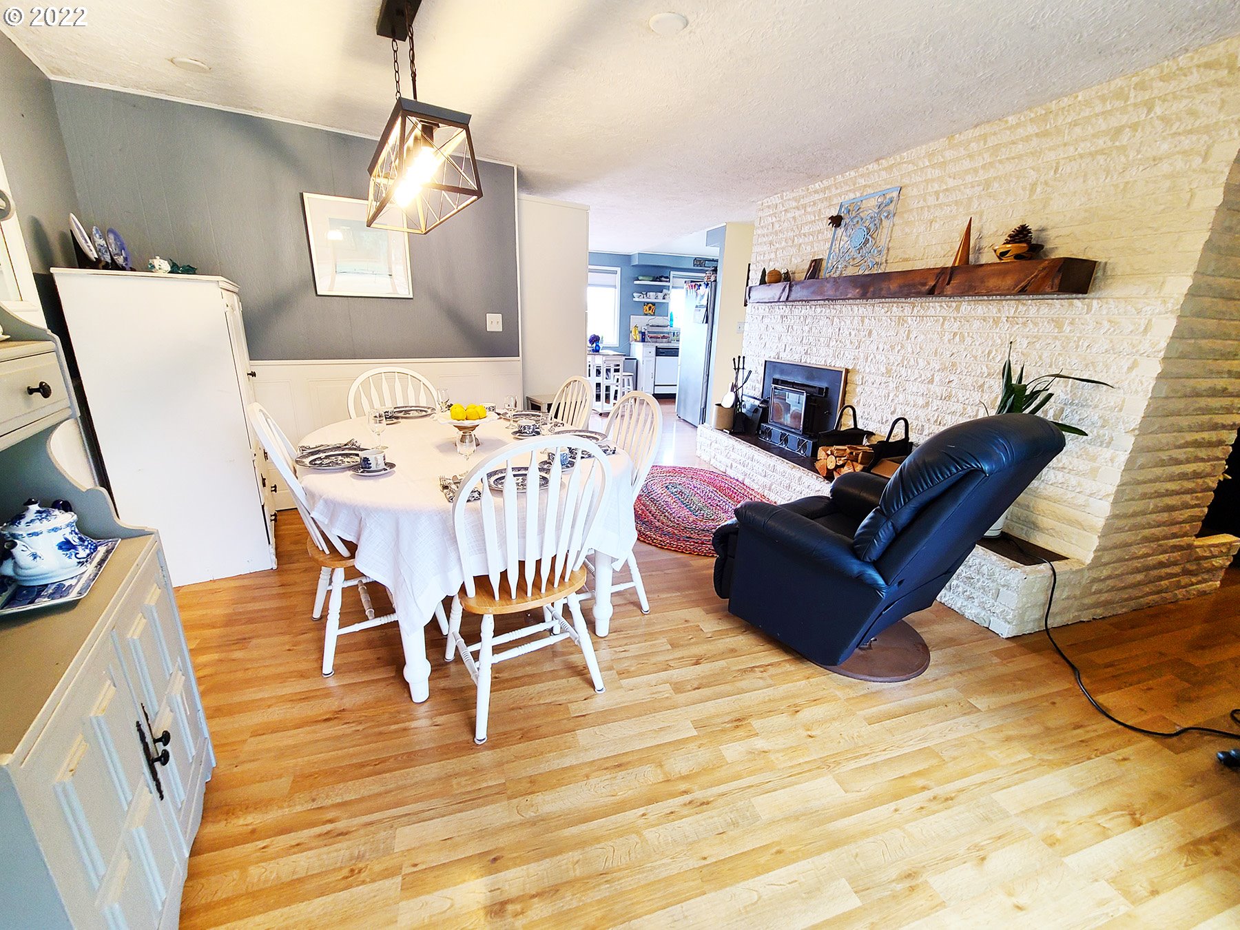 160 Roberson Road Woodland, WA 98674 - Photo 13 of 25 a view of a dining room with furniture a chandelier and wooden floor