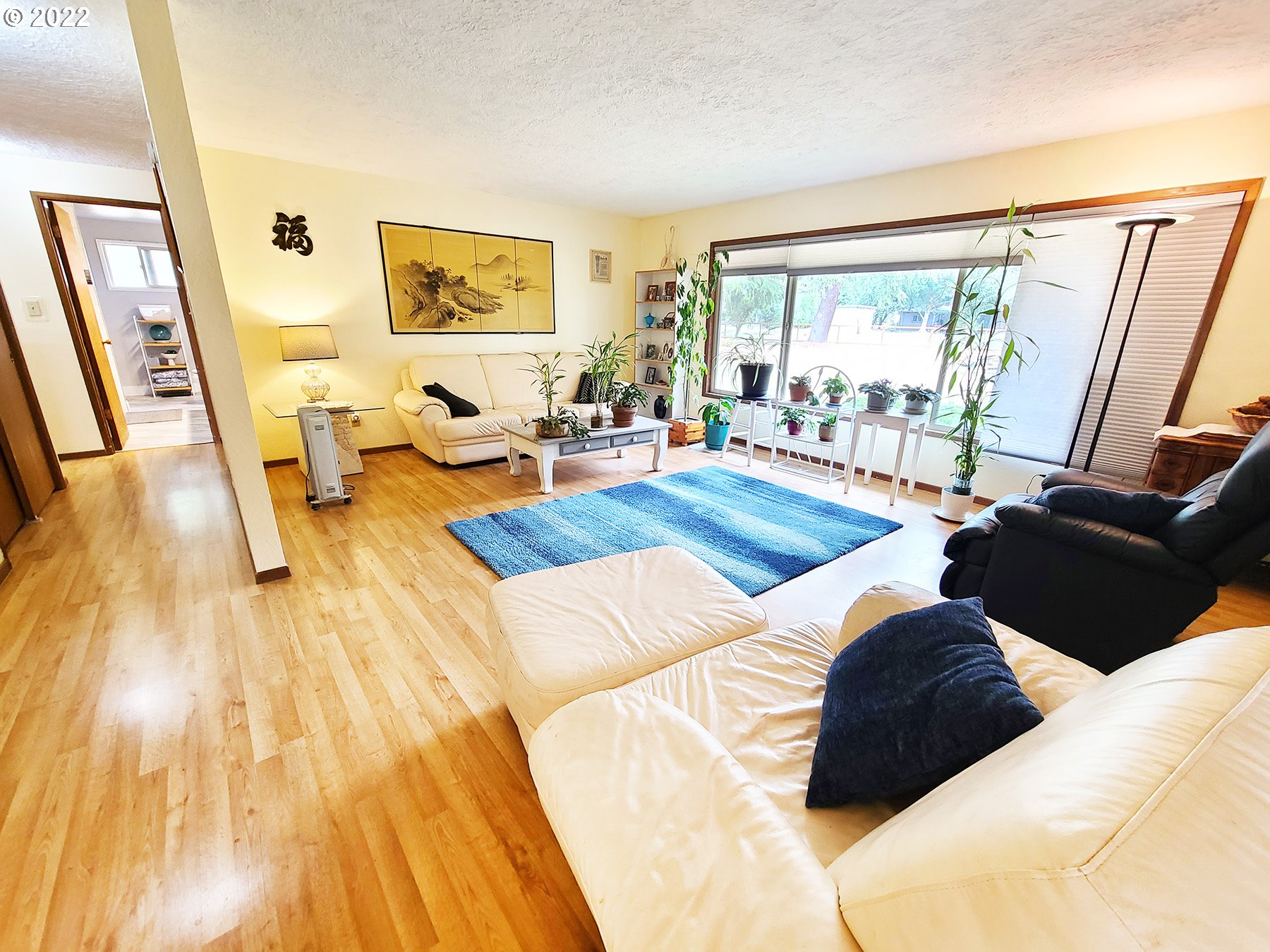 160 Roberson Road Woodland, WA 98674 - Photo 16 of 25 a large bedroom with a bed and wooden floor