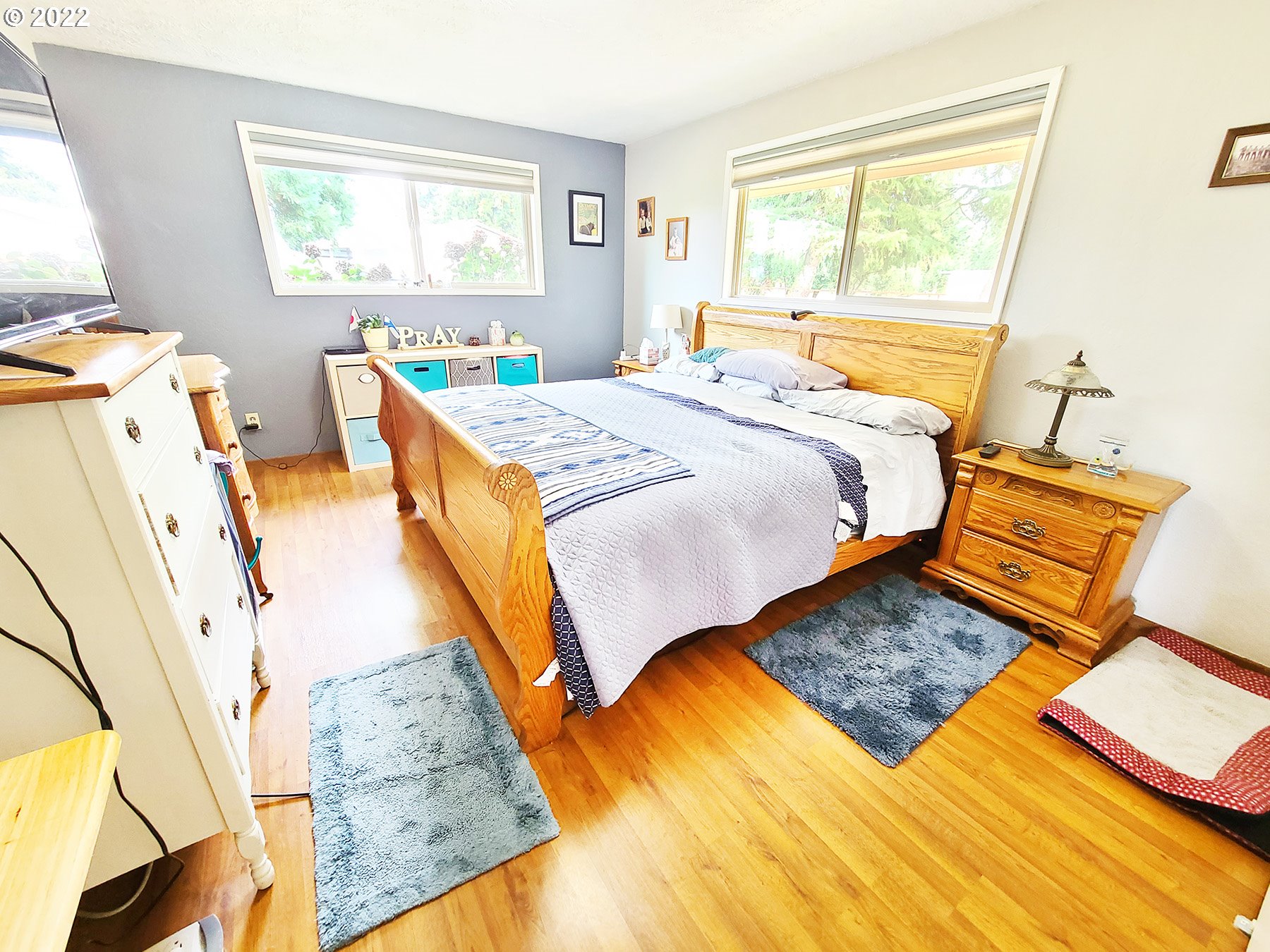 160 Roberson Road Woodland, WA 98674 - Photo 20 of 25 a bedroom with a bed and wooden floor