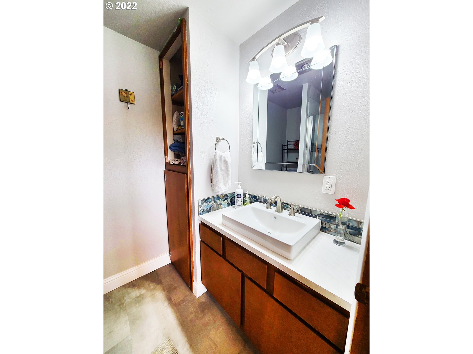 160 Roberson Road Woodland, WA 98674 - Photo 24 of 25 a bathroom with a sink and a mirror