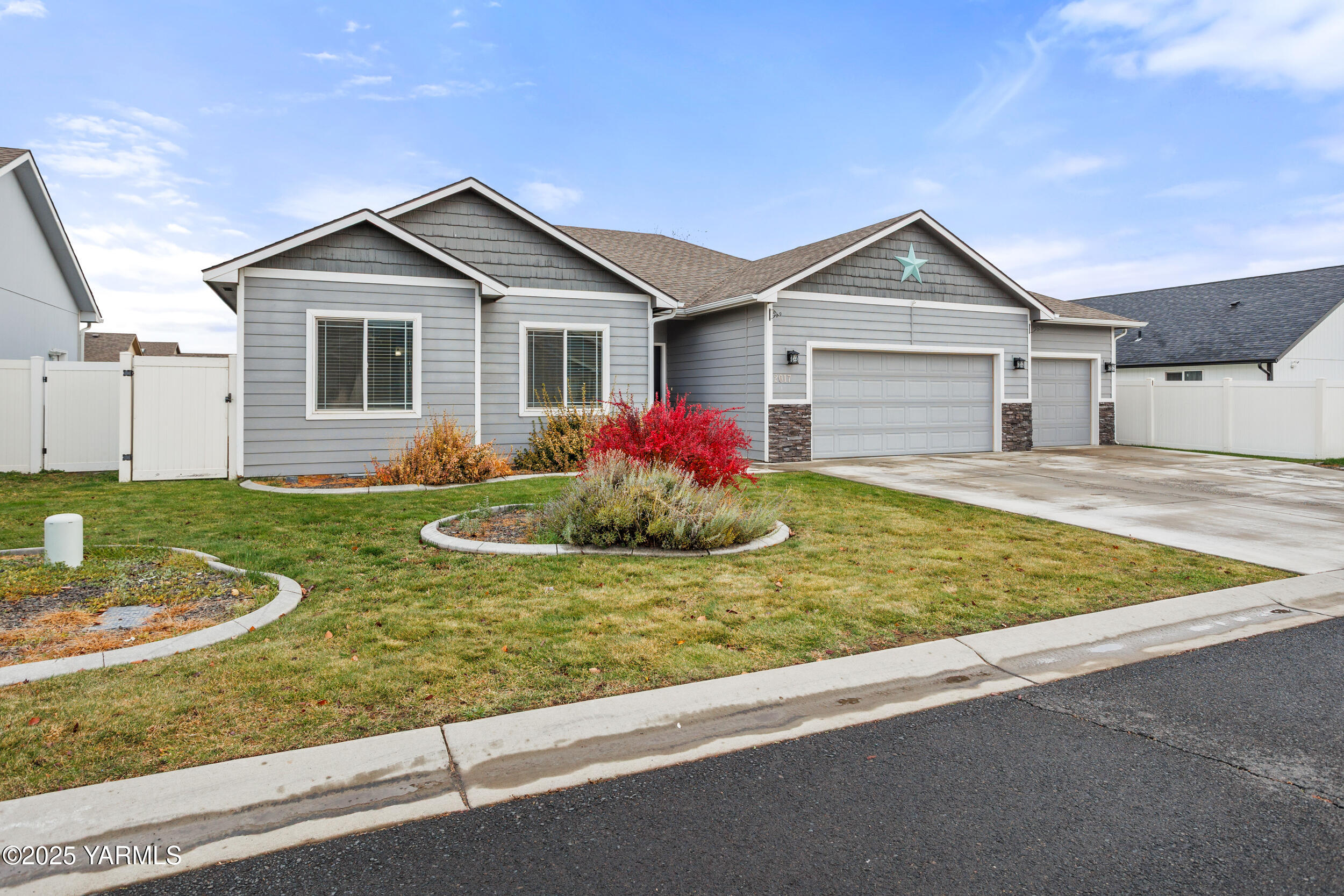 2017 South 59th Avenue Yakima, WA 98903 - Photo 1 of 32 a view of a house with a yard and fence