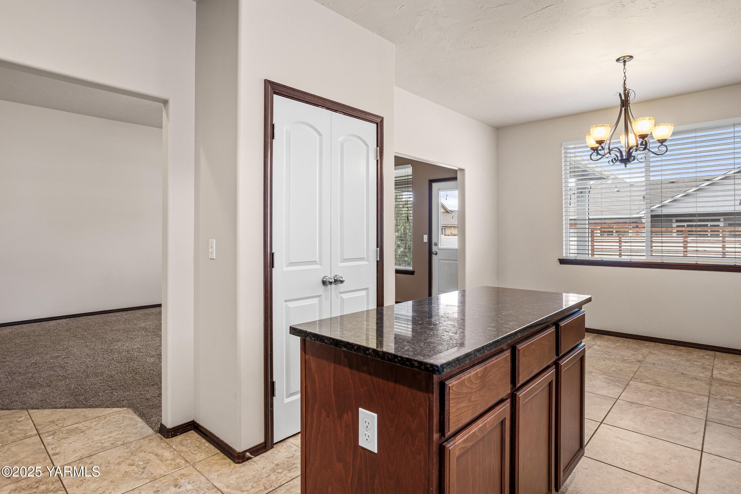 2017 South 59th Avenue Yakima, WA 98903 - Photo 12 of 32 a kitchen with stainless steel appliances granite countertop a sink and a refrigerator