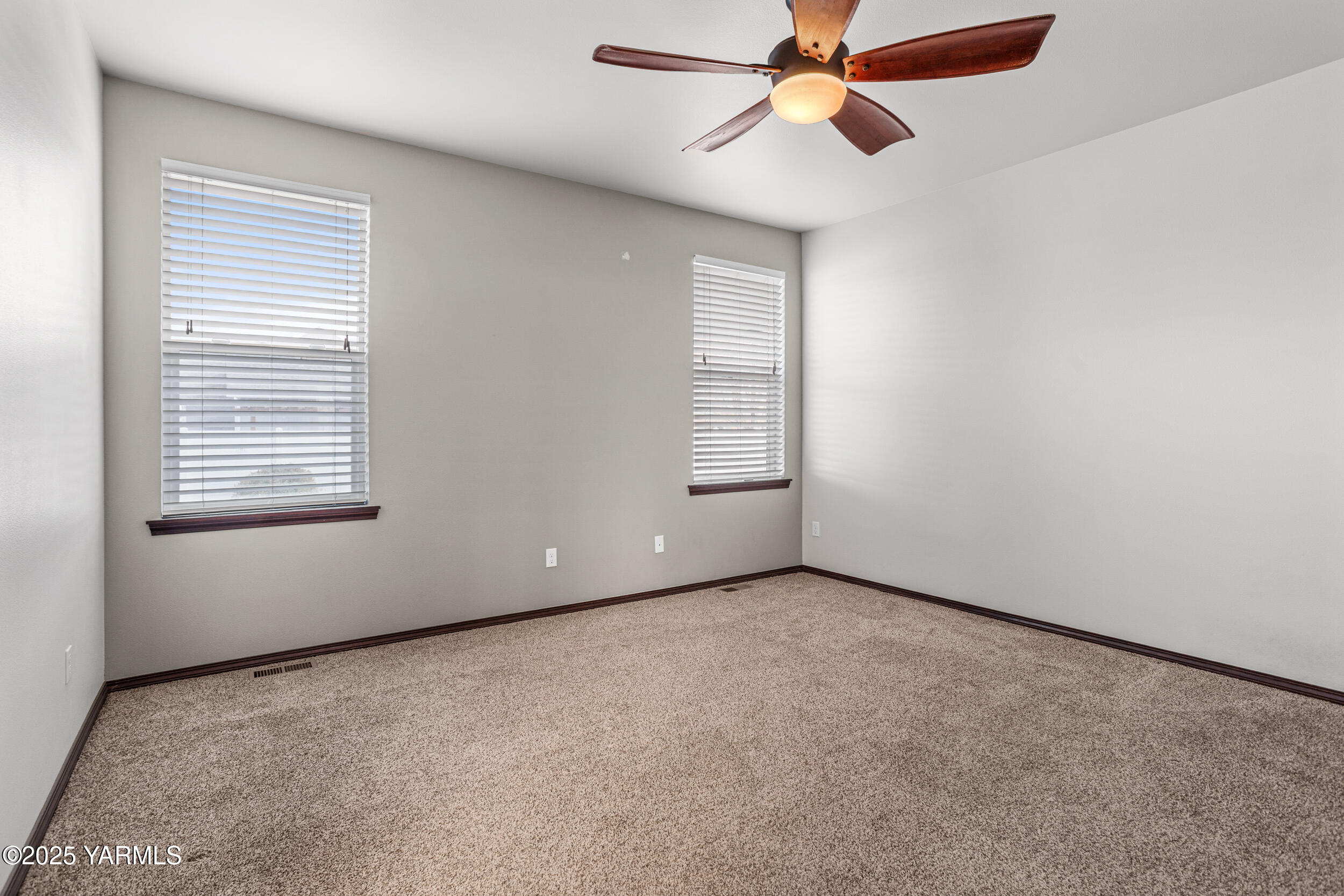 2017 South 59th Avenue Yakima, WA 98903 - Photo 18 of 32 an empty room with windows and fan