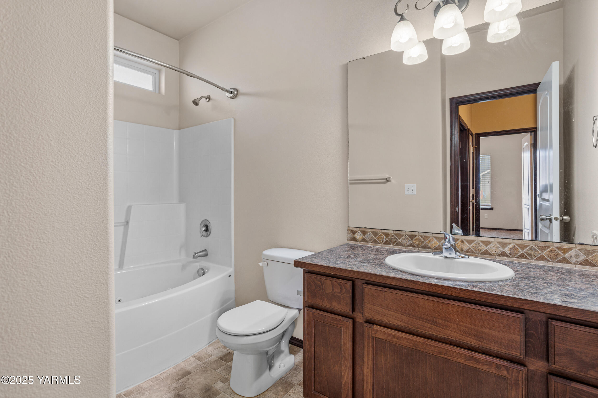 2017 South 59th Avenue Yakima, WA 98903 - Photo 27 of 32 a bathroom with a sink a toilet and shower