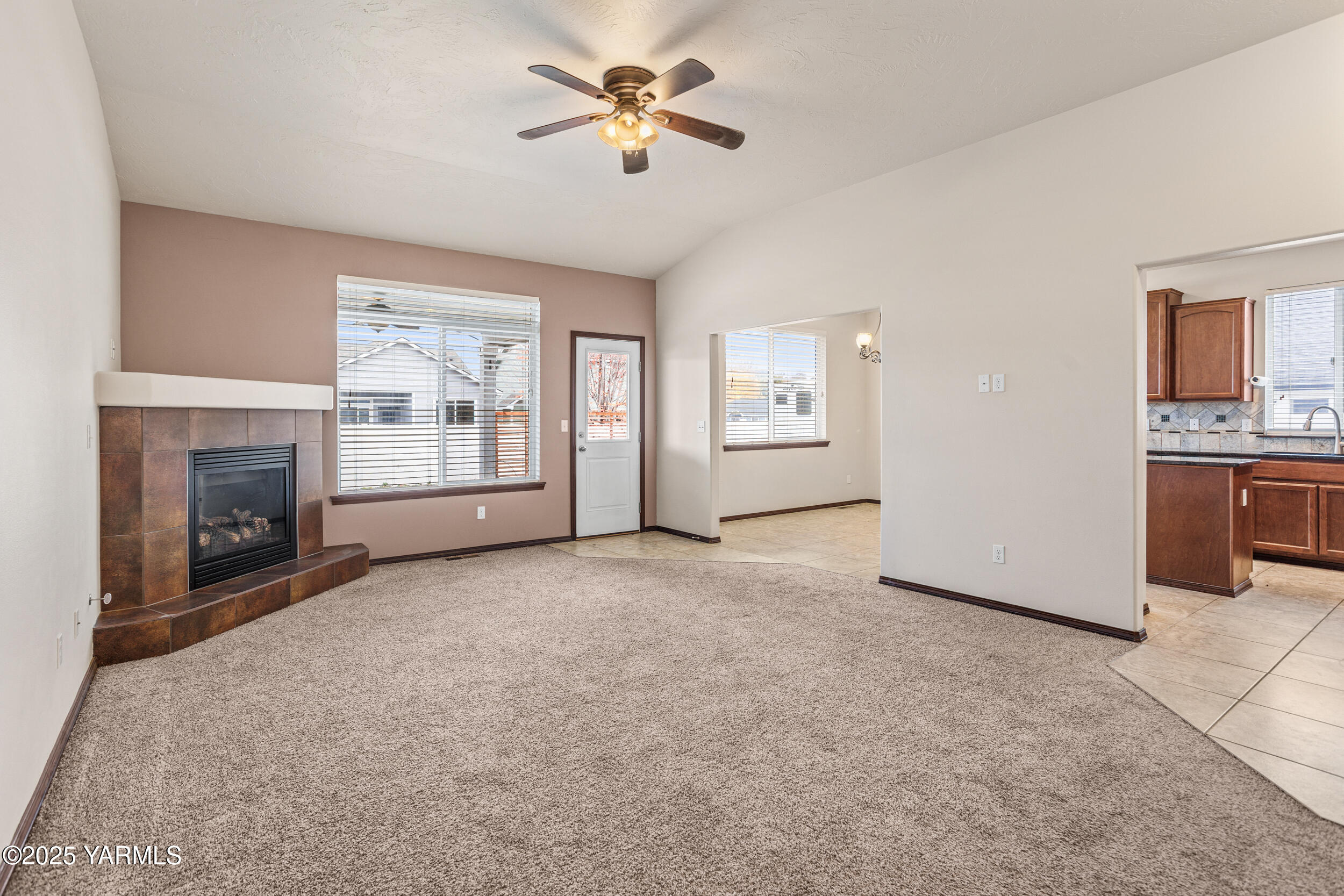 2017 South 59th Avenue Yakima, WA 98903 - Photo 7 of 32 a view of empty room with a fireplace and fan