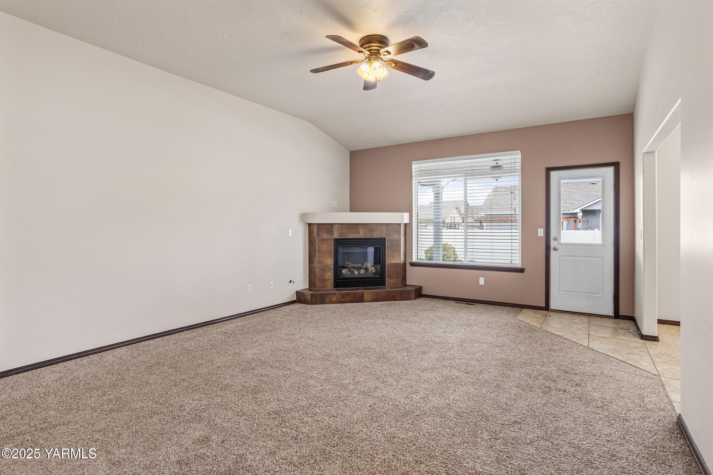 2017 South 59th Avenue Yakima, WA 98903 - Photo 8 of 32 an empty room with windows and fireplace
