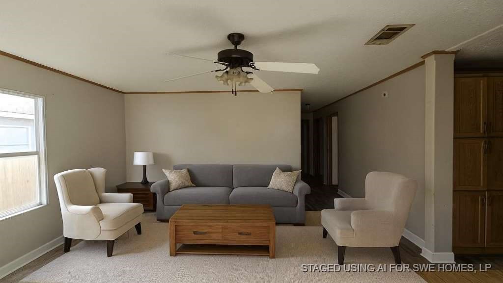 11919 Kingslake Forest Drive Houston, TX 77044 - Photo 6 of 12 a living room with furniture and a window