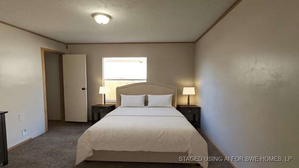 11919 Kingslake Forest Drive Houston, TX 77044 - Photo 10 of 12 a bedroom with a bed and window