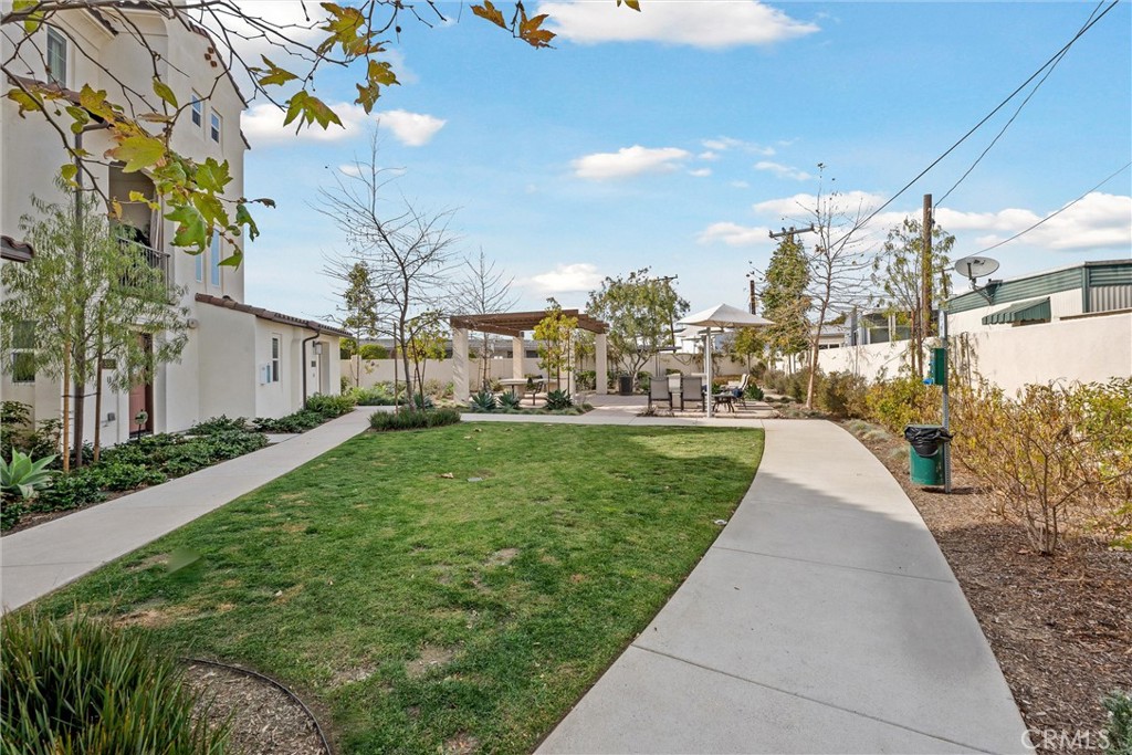 318 Ford Road Costa Mesa, CA 92627 - Photo 18 of 20 a view of a white house with a yard
