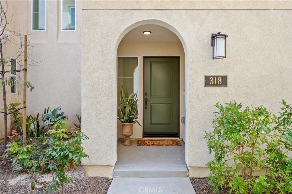 318 Ford Road Costa Mesa, CA 92627 - Photo 2 of 20 a front view of a house with a garden