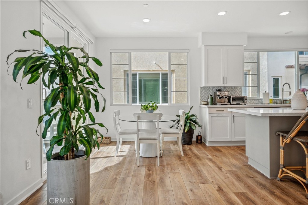 318 Ford Road Costa Mesa, CA 92627 - Photo 5 of 20 a living room with a couch and a potted plant