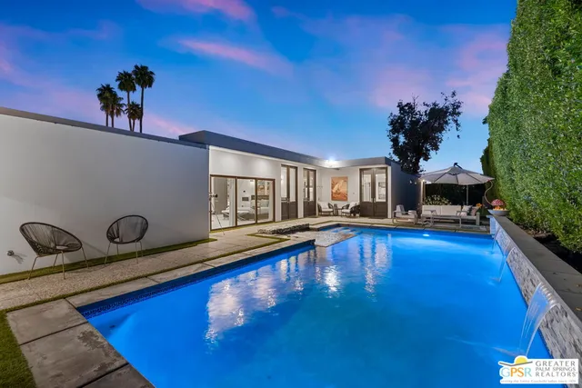 an aerial view of residential house and green space