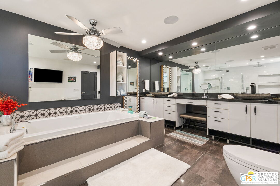48365 Alan Circle Palm Desert, CA 92260 - Photo 14 of 75 a large white kitchen with kitchen island a large island in the center