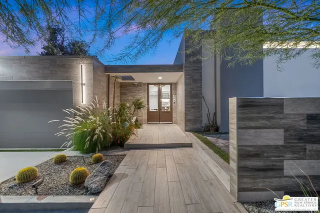 a living room filled with furniture and a fireplace