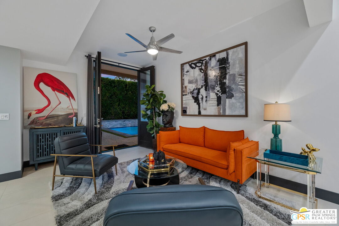 48365 Alan Circle Palm Desert, CA 92260 - Photo 28 of 75 a living room with furniture a lamp and a rug