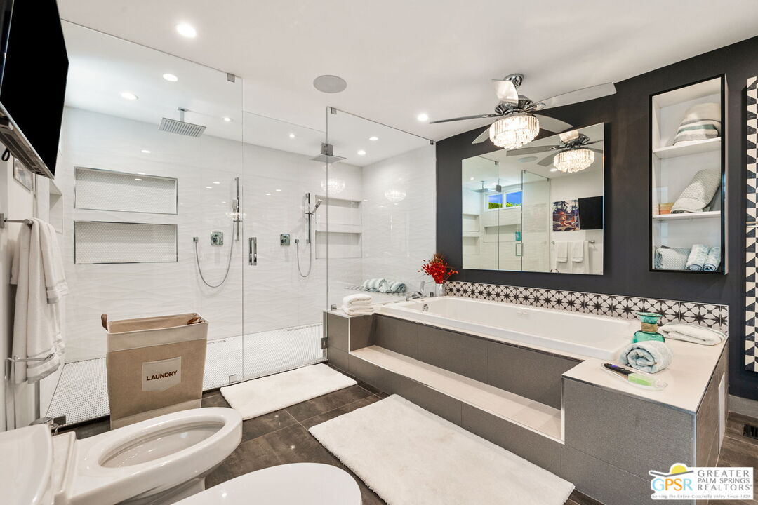 48365 Alan Circle Palm Desert, CA 92260 - Photo 31 of 75 a living room with furniture and a flat screen tv