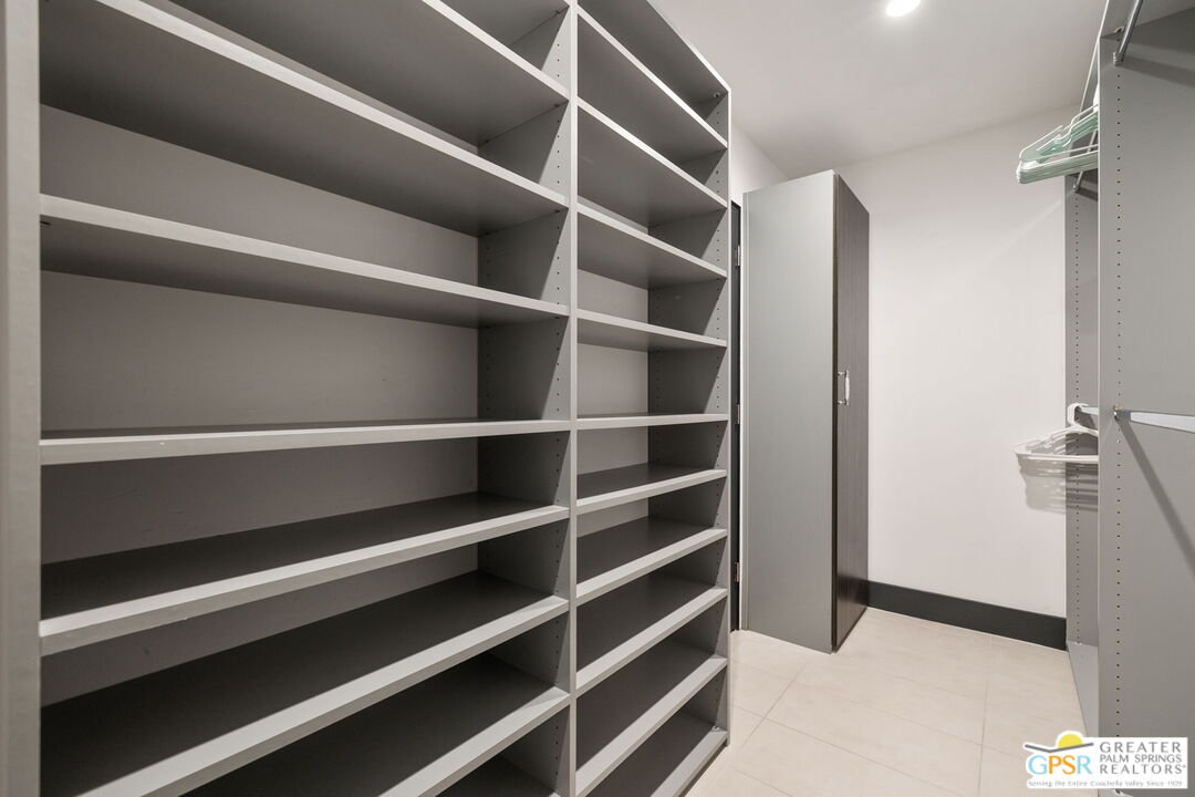48365 Alan Circle Palm Desert, CA 92260 - Photo 32 of 75 a view of walk in closet with empty racks