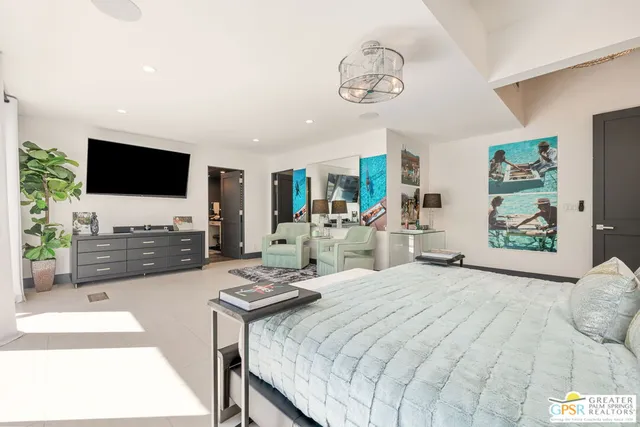 a kitchen with stainless steel appliances granite countertop a sink a stove and a white wooden cabinets