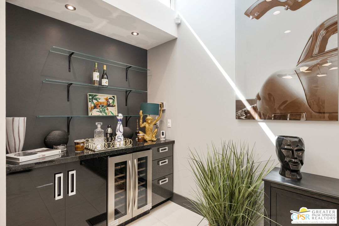 48365 Alan Circle Palm Desert, CA 92260 - Photo 39 of 75 a kitchen with stainless steel appliances granite countertop a sink a stove and a wooden floors