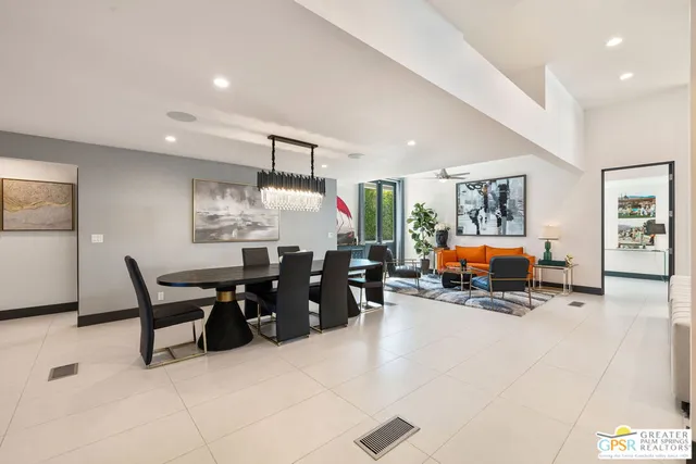 a view of a swimming pool and a lounge chair