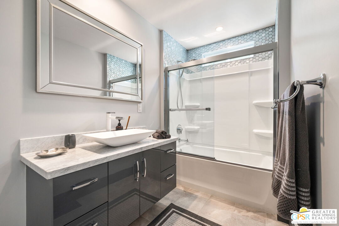 48365 Alan Circle Palm Desert, CA 92260 - Photo 51 of 75 a bathroom with a sink and a mirror