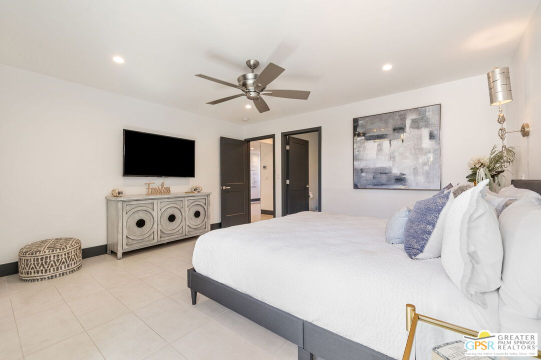 48365 Alan Circle Palm Desert, CA 92260 - Photo 53 of 75 a bedroom with a bed and a flat screen tv