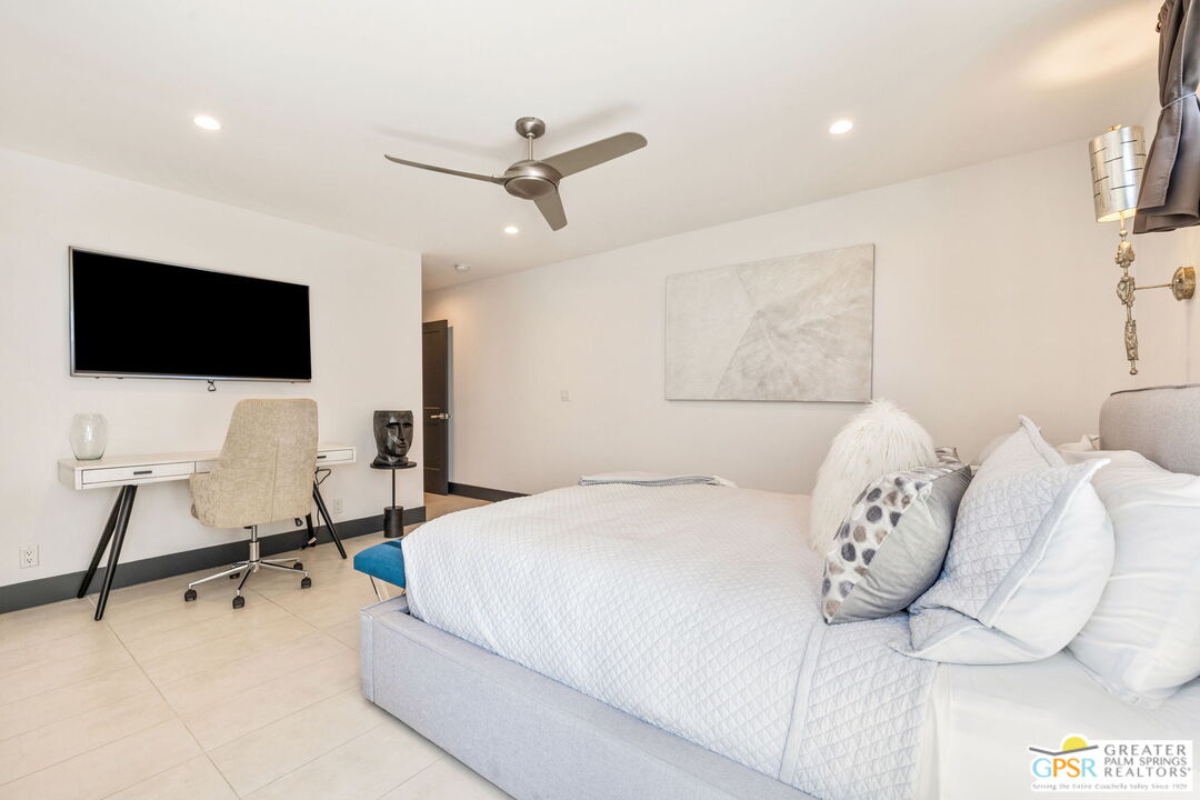 48365 Alan Circle Palm Desert, CA 92260 - Photo 56 of 75 a bedroom with a bed and a flat screen tv