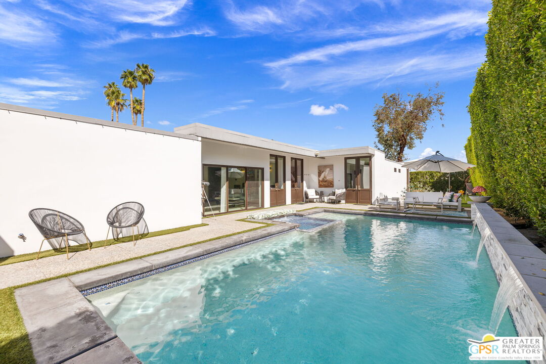 48365 Alan Circle Palm Desert, CA 92260 - Photo 59 of 75 a view of a swimming pool and a lounge chair