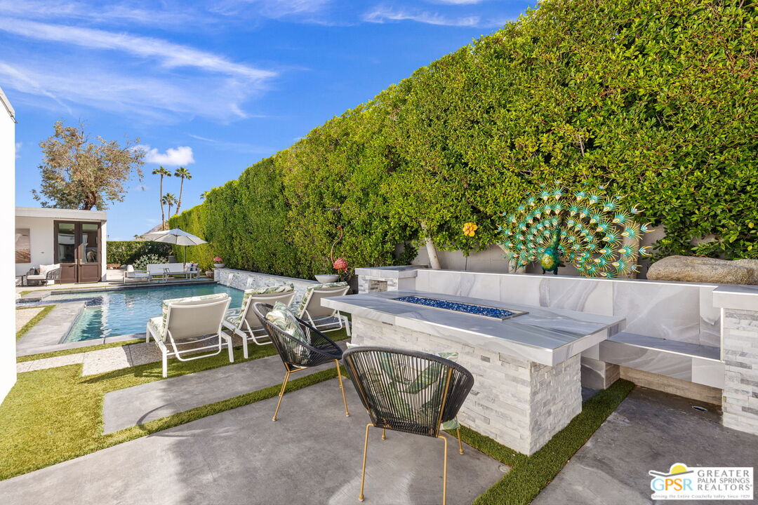 48365 Alan Circle Palm Desert, CA 92260 - Photo 61 of 75 a view of a patio with couches table and chairs and potted plants
