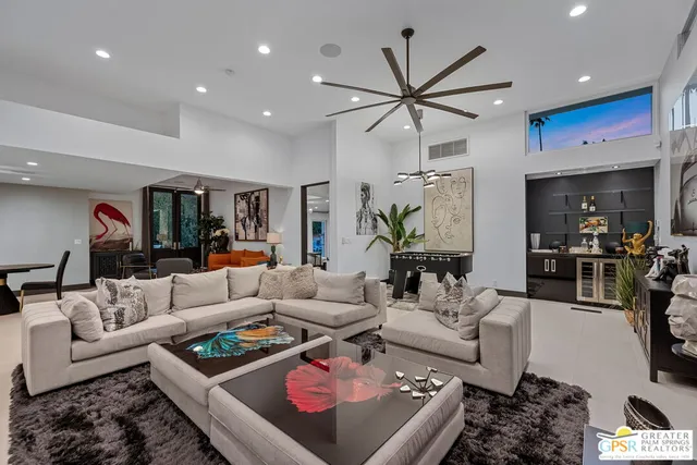 a kitchen with stainless steel appliances granite countertop a sink a stove and cabinets