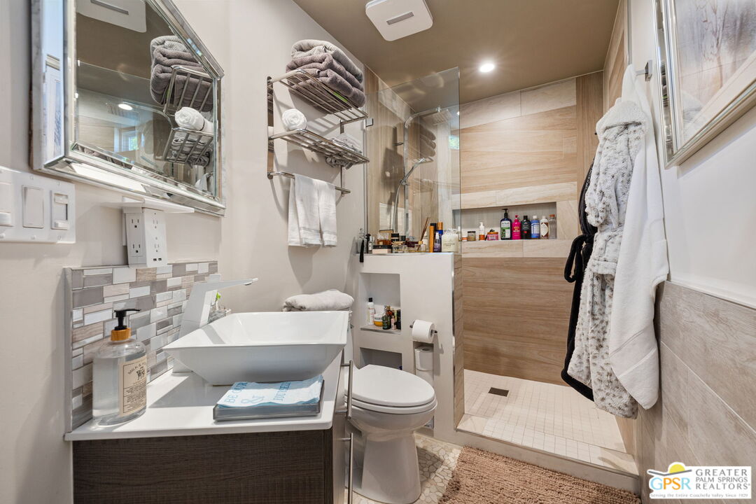48365 Alan Circle Palm Desert, CA 92260 - Photo 71 of 75 a bathroom with a sink toilet and shower