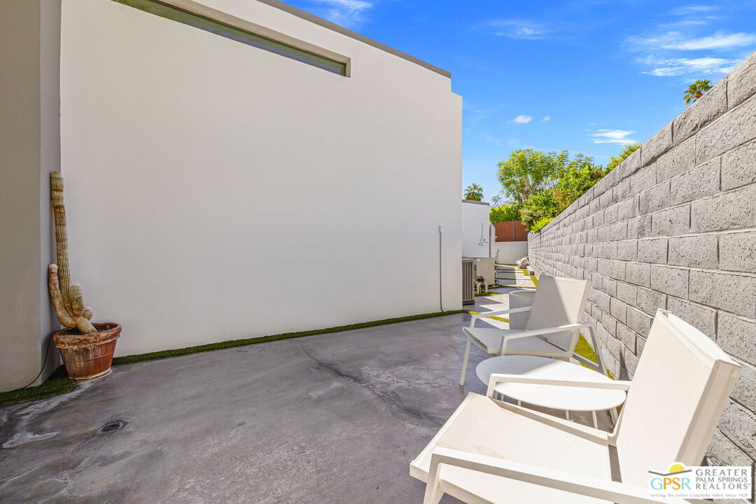 48365 Alan Circle Palm Desert, CA 92260 - Photo 73 of 75 a view of a room with chairs and a potted plant