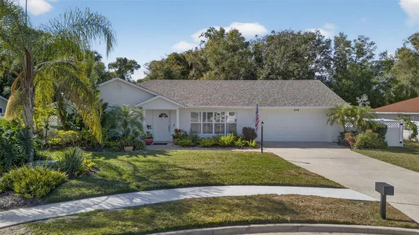 a aerial view of a house with a yard