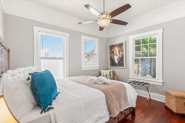 a bedroom with a large bed and a window