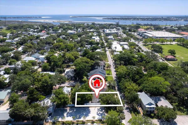 an aerial view of residential houses with outdoor space
