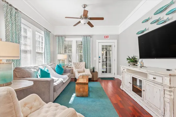 a living room with furniture and a flat screen tv