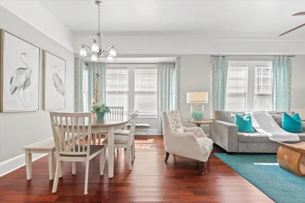 a view of a livingroom with furniture window and wooden floor