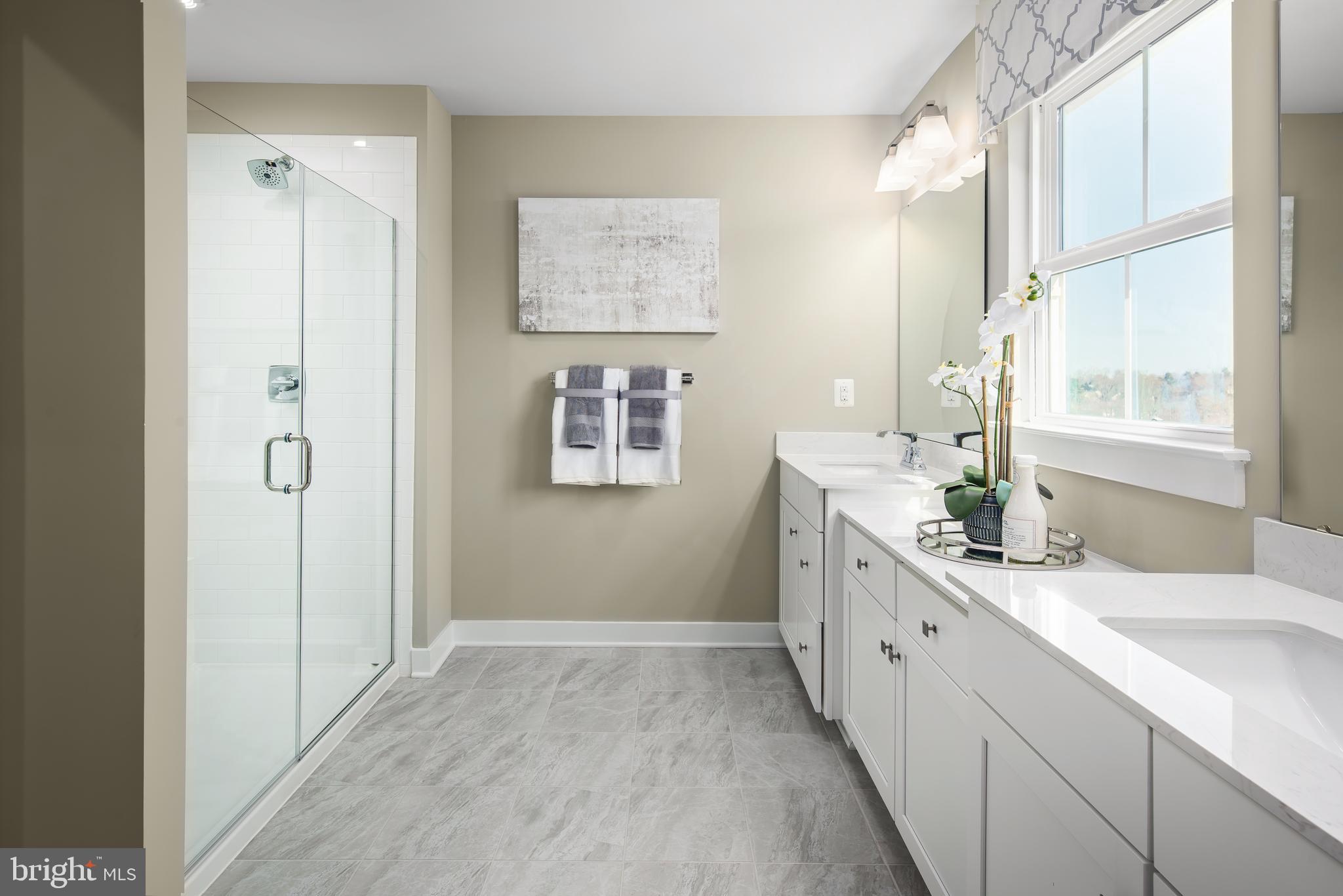 1515 Wallace Way Ranson, WV 25438 - Photo 18 of 18 a bathroom with a double vanity sink a mirror and a shower