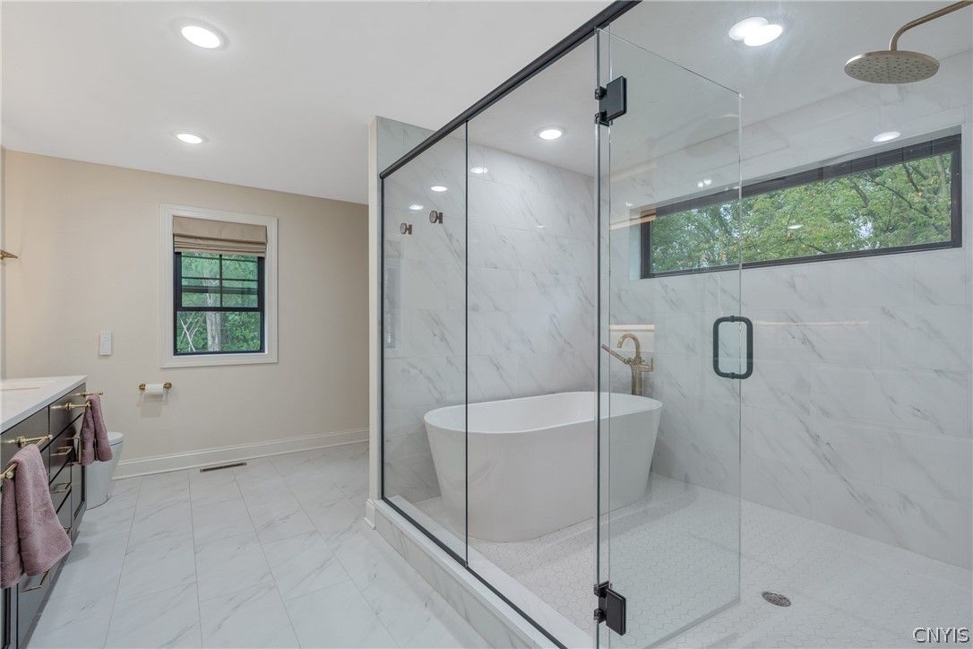 2020 Rubicon Road Lysander, NY 13027 - Photo 33 of 49 At the end of your long day enjoy a hot bath in the soaking tub or under the Delta brass rain shower!