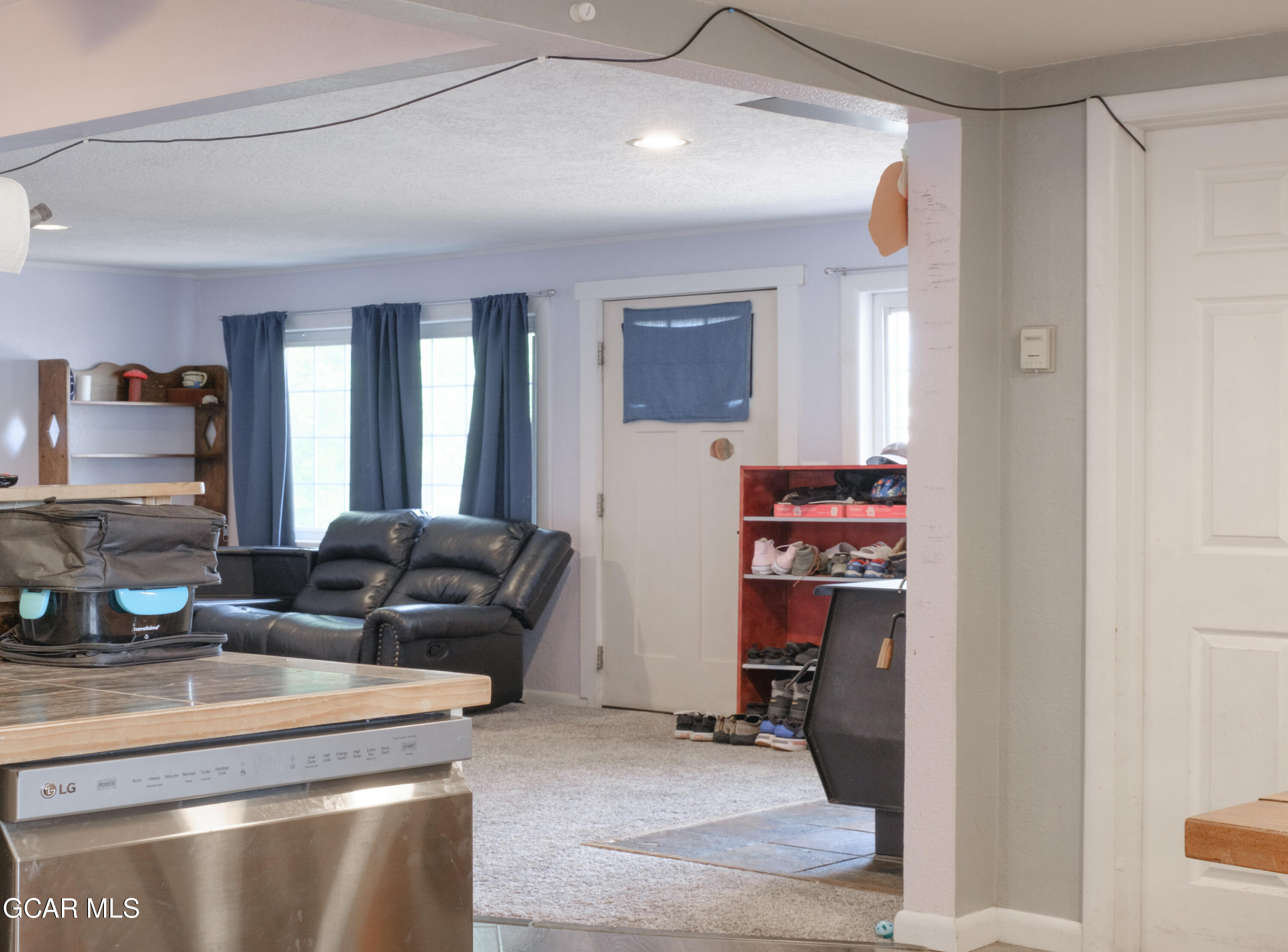 404 5th Street Kremmling, CO 80459 - Photo 10 of 56 a living room with furniture and a flat screen tv