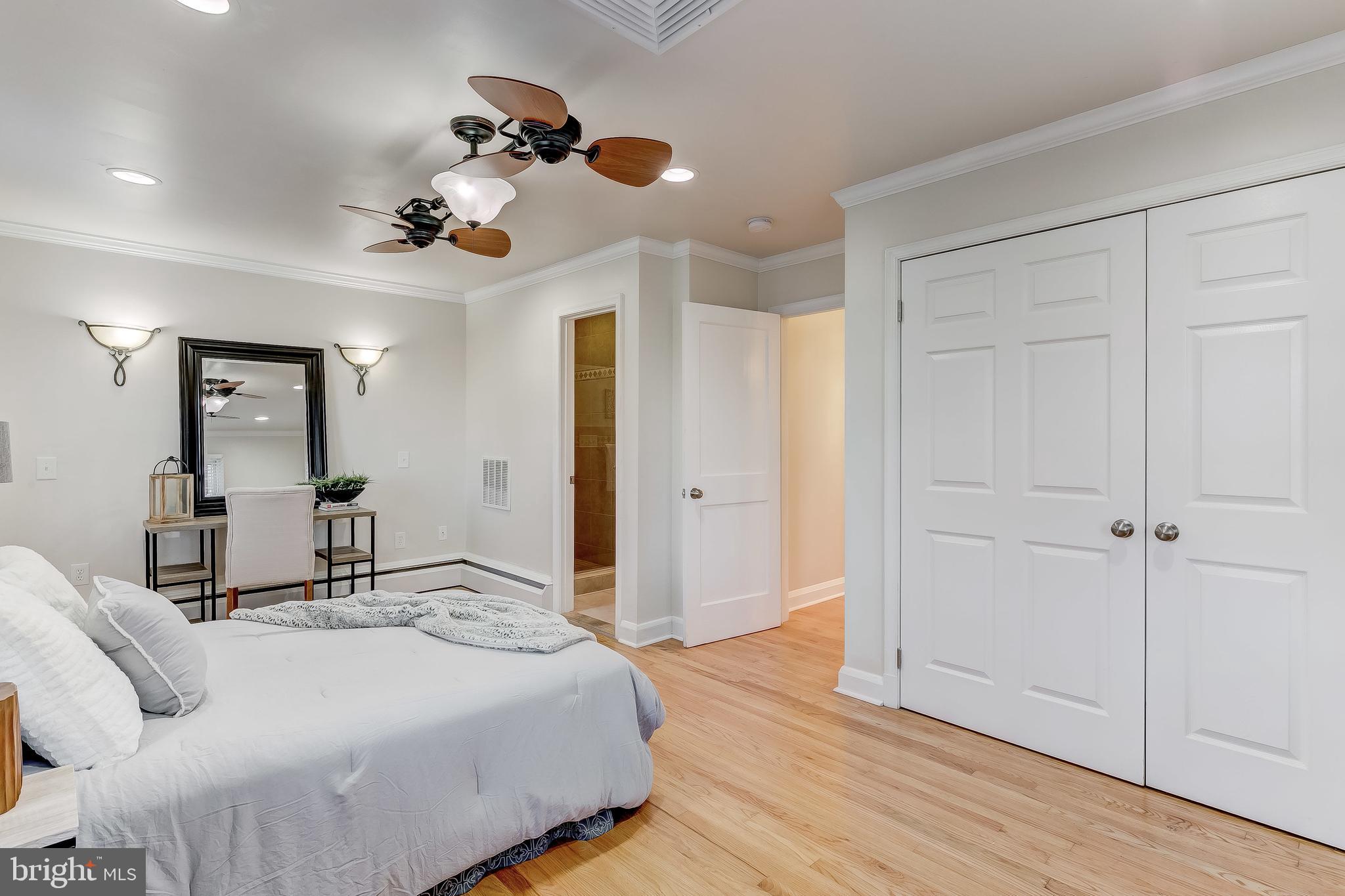 2013 Ruxton Road Baltimore, MD 21204 - Photo 22 of 54 a bedroom with a bed and a chandelier
