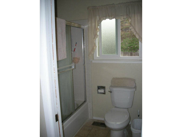 3083 Messinger Drive Marina, CA 93933 - Photo 17 of 18 a white toilet sitting next to a bathroom sink