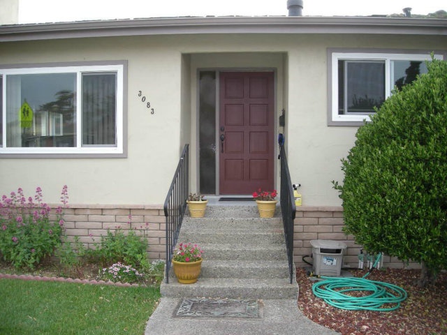 3083 Messinger Drive Marina, CA 93933 - Photo 3 of 18 a front view of a house with garden