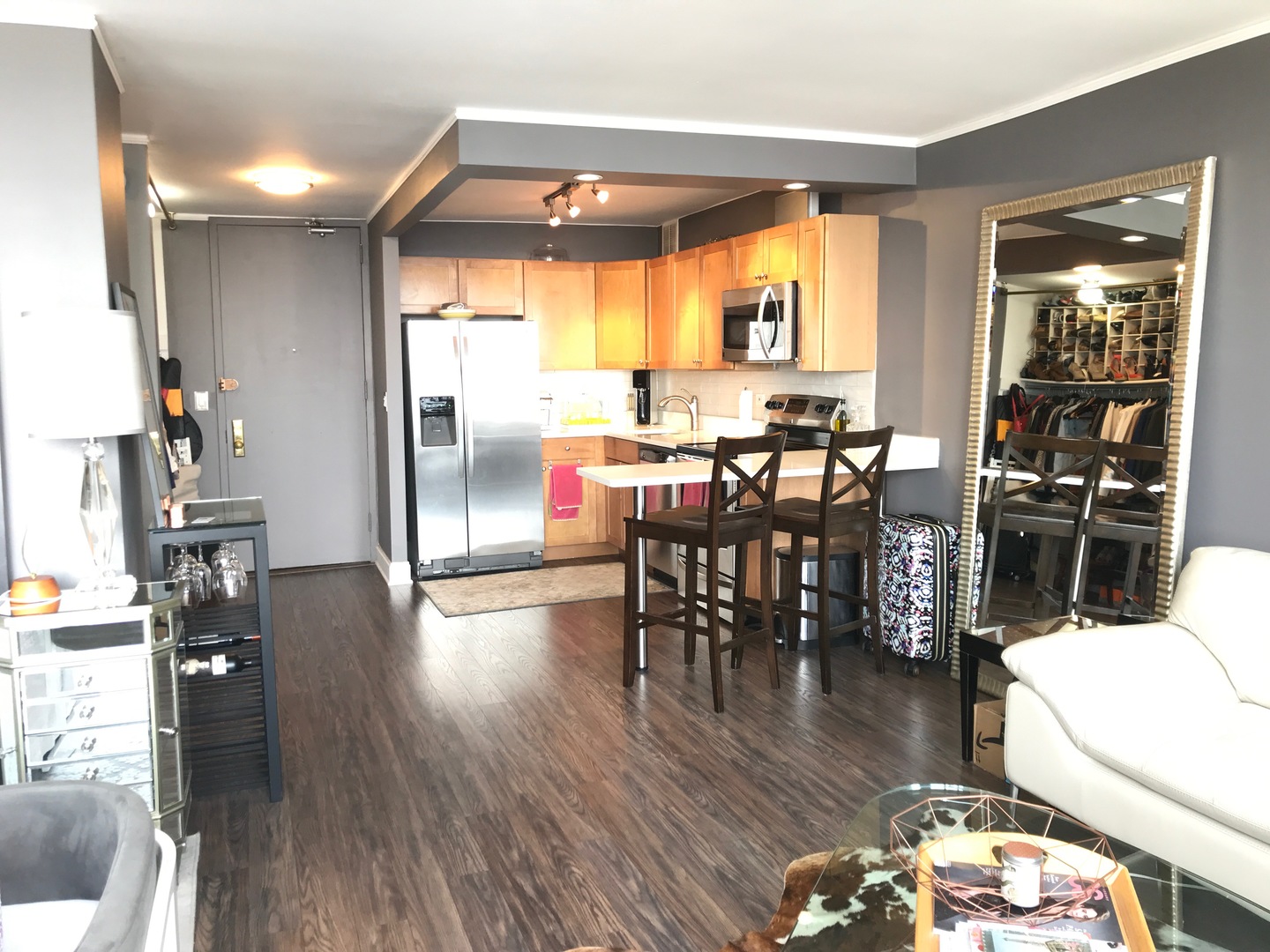 655 West Irving Park Road, Unit 2911 Chicago, IL 60613 - Photo 16 of 42 a view of a dining room with furniture and wooden floor