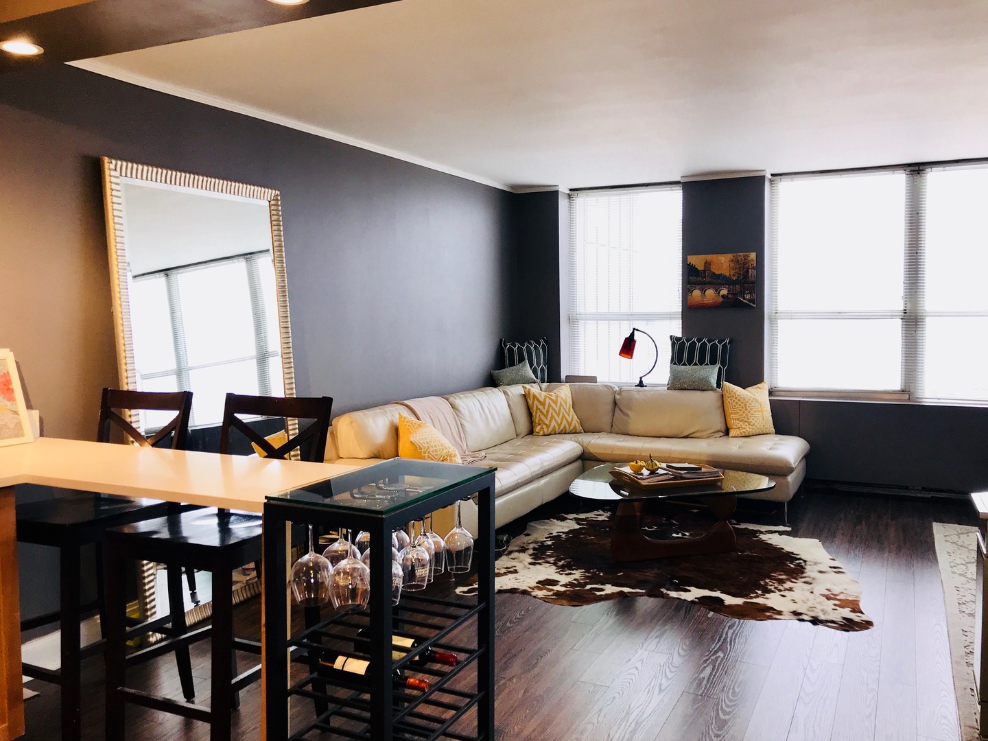 655 West Irving Park Road, Unit 2911 Chicago, IL 60613 - Photo 24 of 42 a living room with furniture and wooden floor