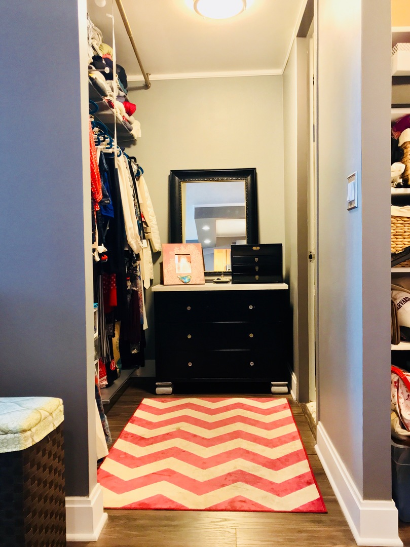 655 West Irving Park Road, Unit 2911 Chicago, IL 60613 - Photo 28 of 42 a bedroom with a bed and a dresser
