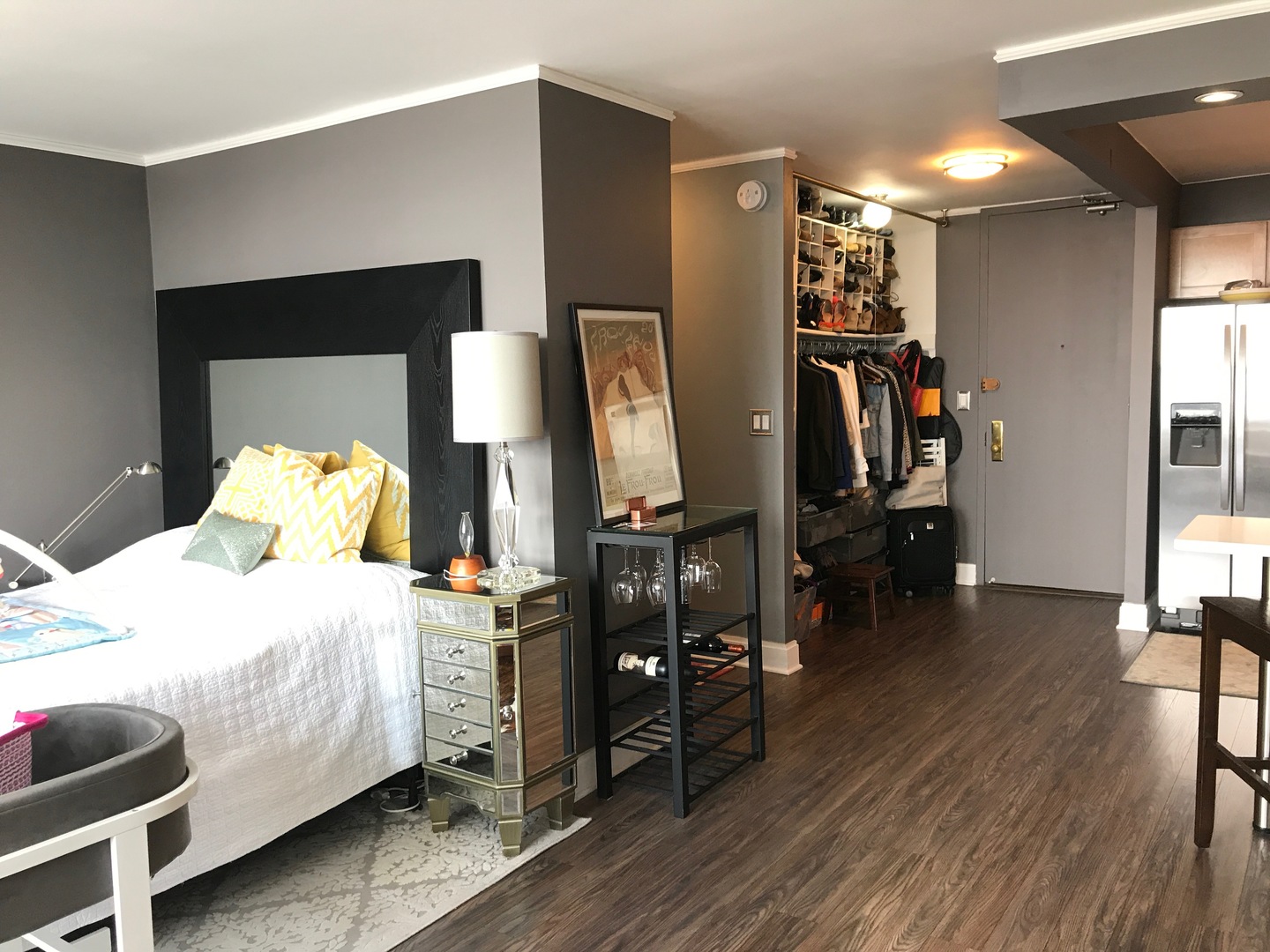 655 West Irving Park Road, Unit 2911 Chicago, IL 60613 - Photo 36 of 42 a bedroom with a bed and wooden floor