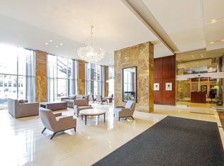 655 West Irving Park Road, Unit 2911 Chicago, IL 60613 - Photo 4 of 42 a living room with furniture and large windows