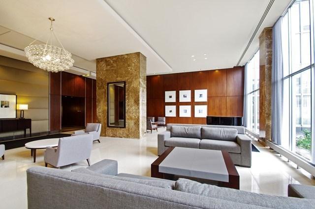 655 West Irving Park Road, Unit 2911 Chicago, IL 60613 - Photo 5 of 42 a living room with furniture and a large window